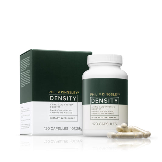 Philip Kingsley Density amino acid tablets bottle close-up for healthy hair support.
