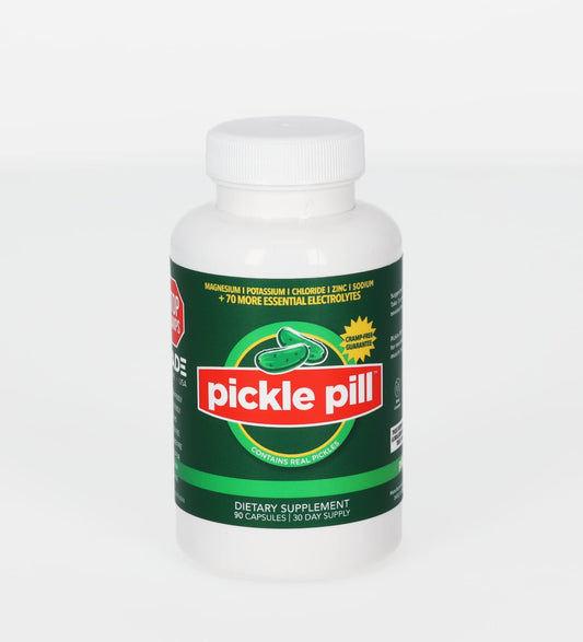 PicklePill Cramp Defense bottle being poured to showcase rapid electrolyte delivery.