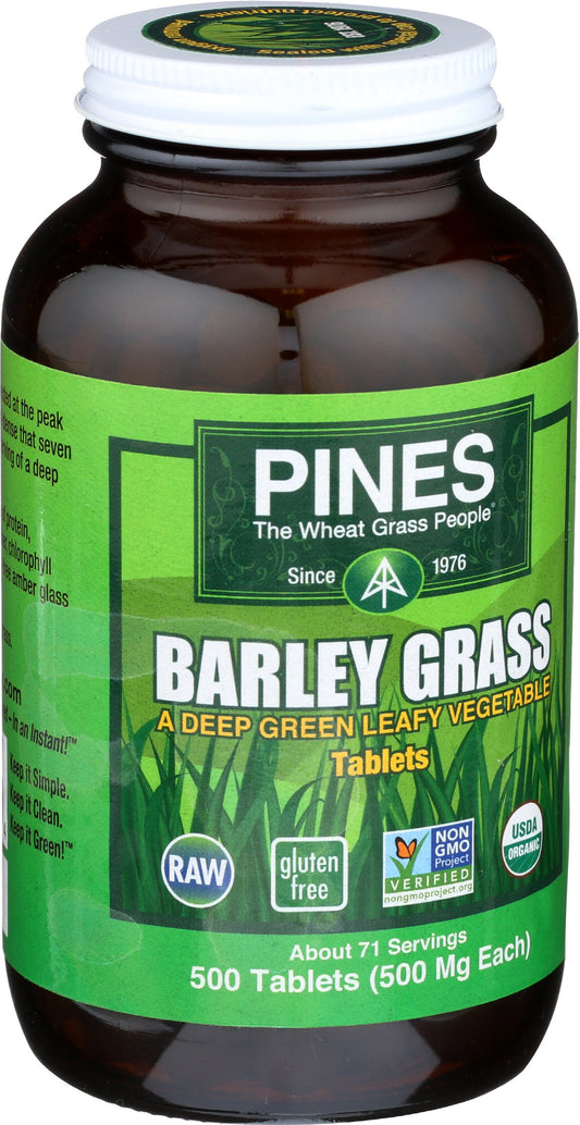 Pines Organic Barley Grass capsules close-up showing plant-based nutrition.