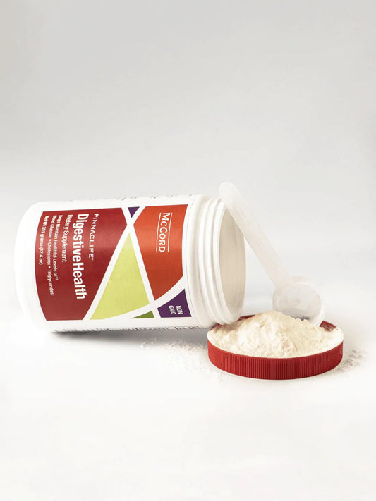 Pinnaclife DigestiveHealth scoop dissolving in liquid for smooth mixing with no grit.