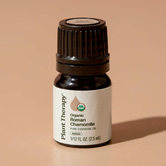 Diluted Plant Therapy Roman Chamomile oil applied to skin for comfort.