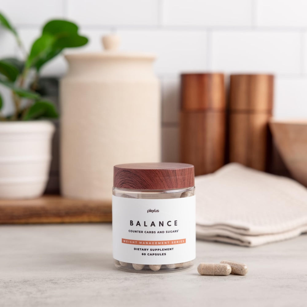 Close-up of Plexus Balance capsules showing smooth texture.