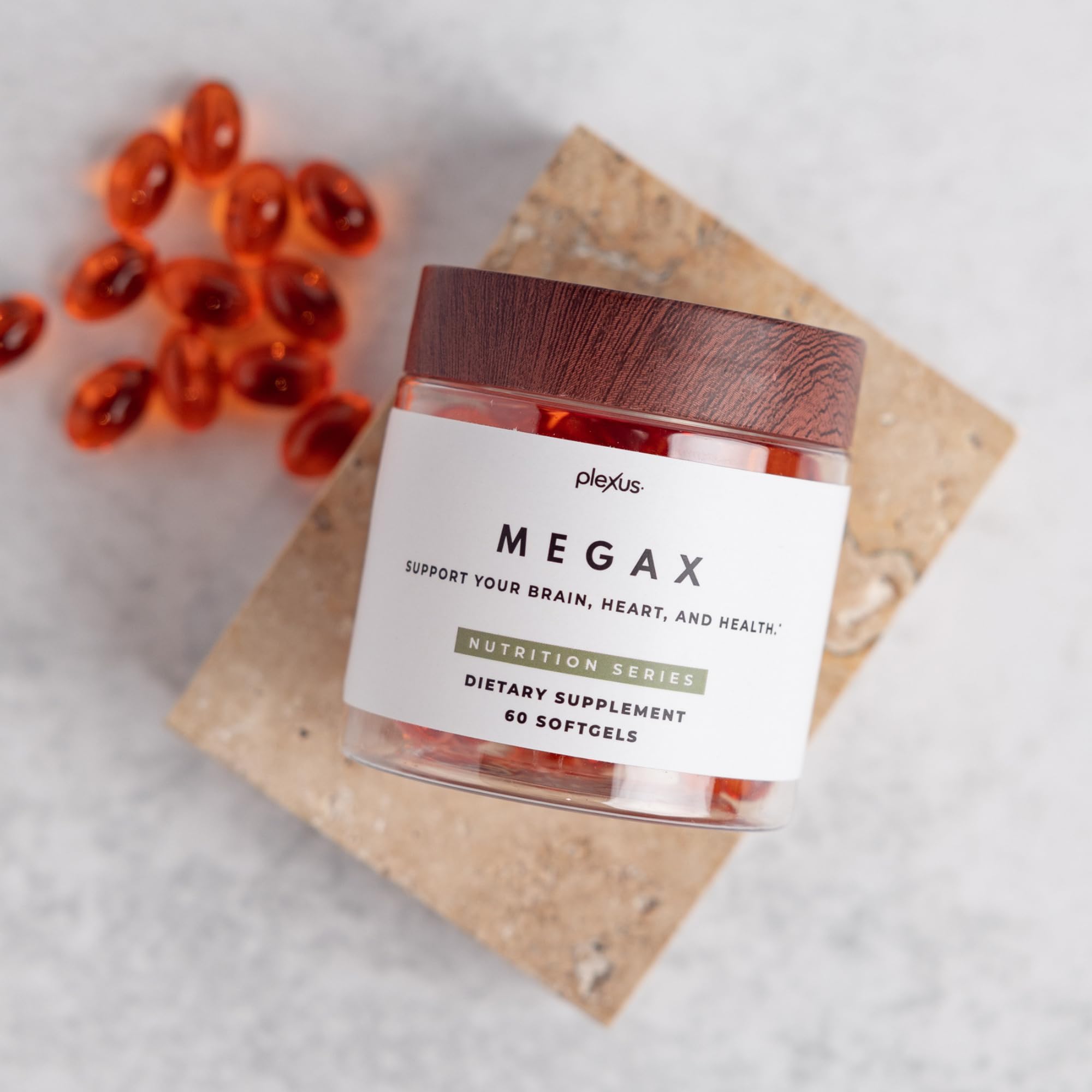 Plexus MegaX pomegranate seed oil bottle emphasizing punicic acid for balanced fats.