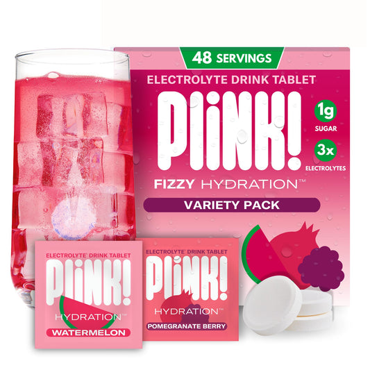 Plink fizzy tablet being poured into water for refreshing daily hydration.