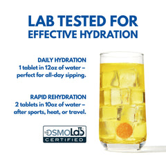 Plink tablet about to fizz in a clear glass of water.
