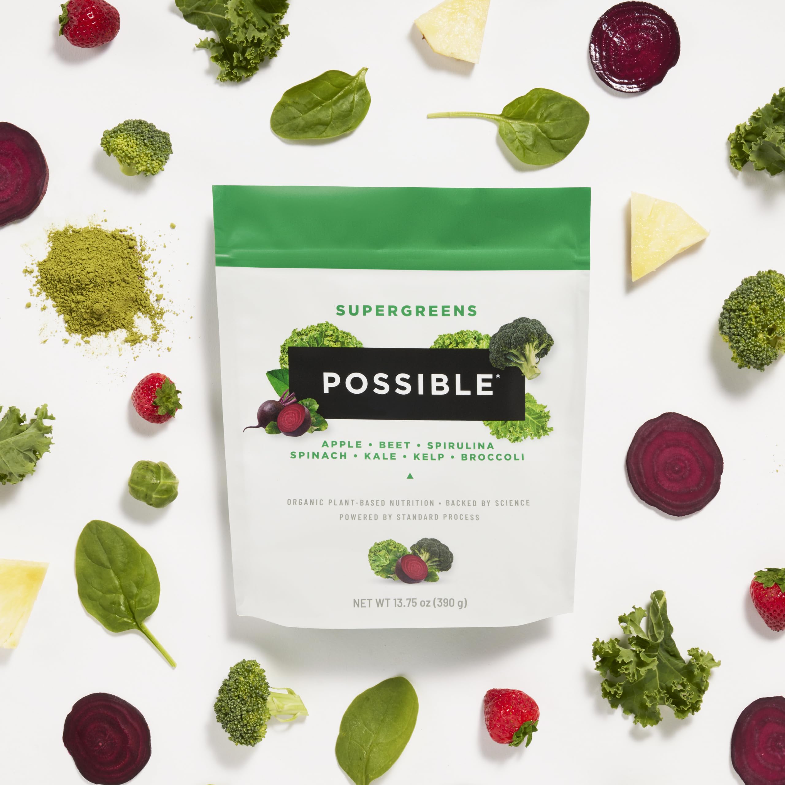 Possible SuperGreens measuring scoop beside powder for quick daily nutrition.
