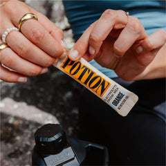 Potion electrolyte scoop measures powder for on-the-go hydration during workouts