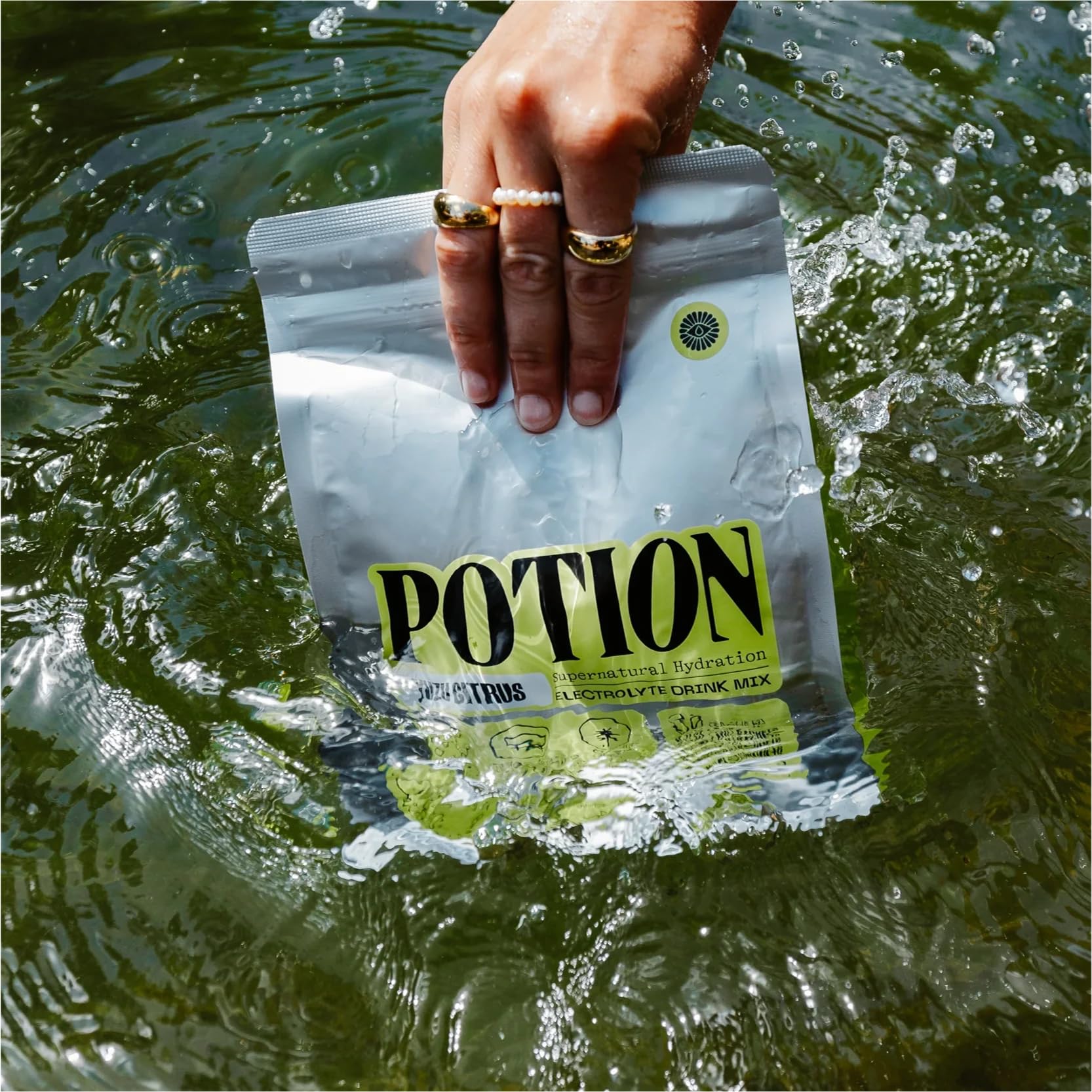 Potion Supernatural Hydration scoop measure demonstrates precise dosing for zero-sugar electrolyte refreshment.