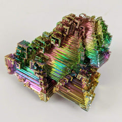 Pounique Bismuth crystal with iridescent steps for meditative display.