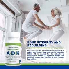 Power By Naturals ADK dispensing capsules illustrate convenient daily use.