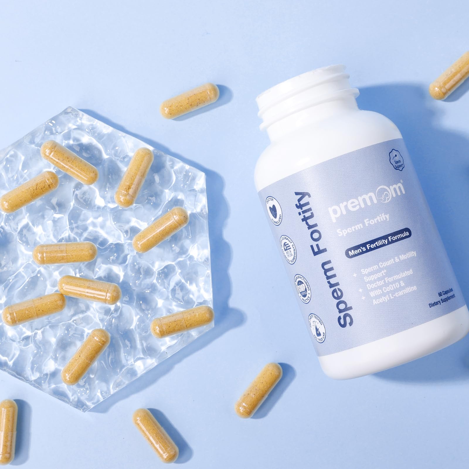 Premom Sperm Fortify capsules close-up demonstrates the two-capsule daily serving.