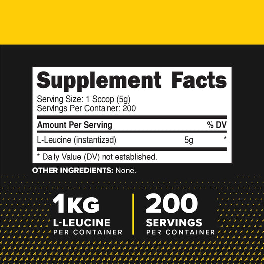 Primaforce L-Leucine powder scoop resting beside jar, indicating convenient serving size.