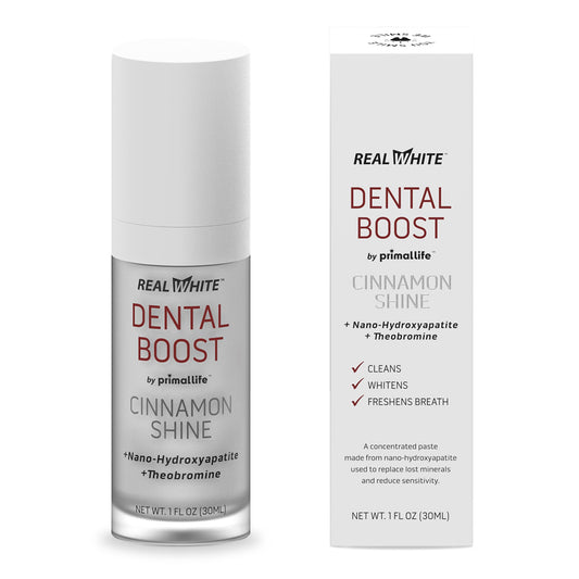 Primal Life Real White Dental Boost toothpaste tube showing natural ingredients.