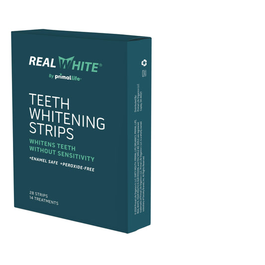 Primal Life Real White Strips packaging highlighting all-natural whitening for on-the-go use.