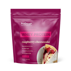 ProDough Gourmet Whey Isolate Raspberry Cheesecake jar offers rich aroma for a satisfying shake.