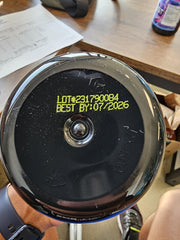 Athlete holds TauroTest bottle during workout