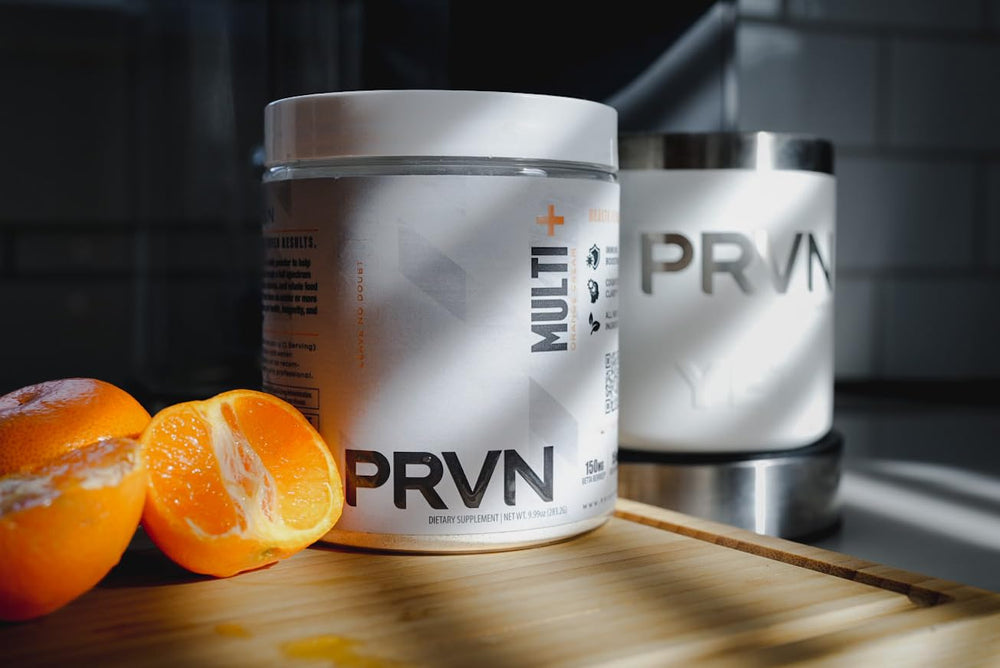 PRVN Performance Multi+ Green glass with prepared drink, emphasizing a refreshing wellness ritual.