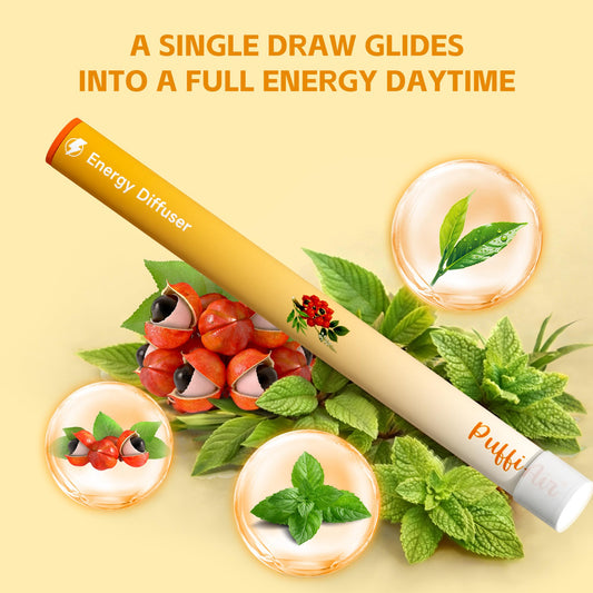 PUFFIAIR energizing diffuser on desk promotes sustained alertness with guarana and green tea.