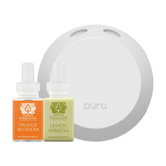 Pura 4 diffuser on table delivers even fragrance for a cozy room.