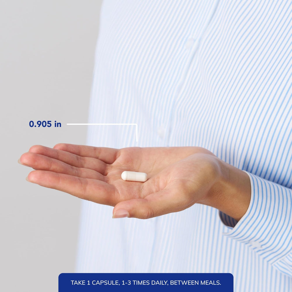 Capsules in hand showing convenient daily supplement from Pure Encapsulations.