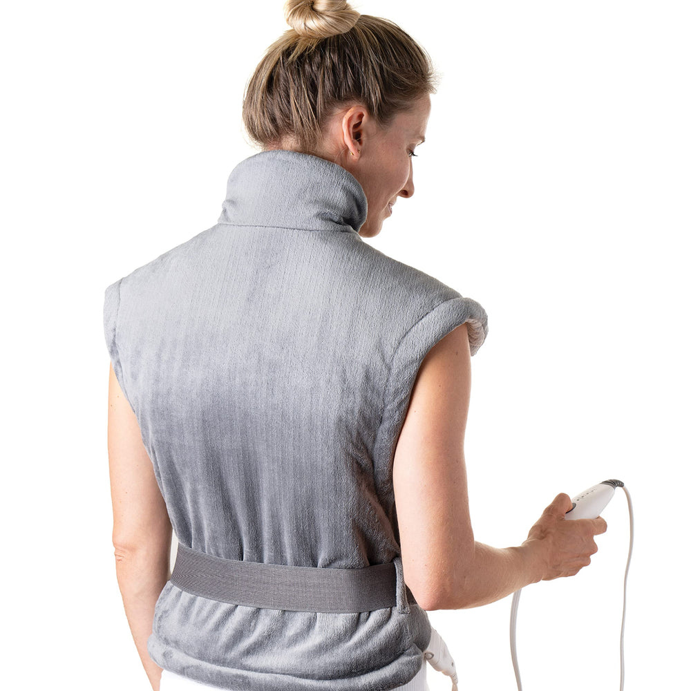 Pure Enrichment PureRelief XL full-length pad on bed for whole-back warmth.