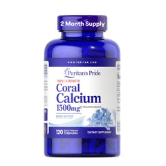 Puritan's Pride coral calcium bottle front with rapid-release capsules for daily bone support.