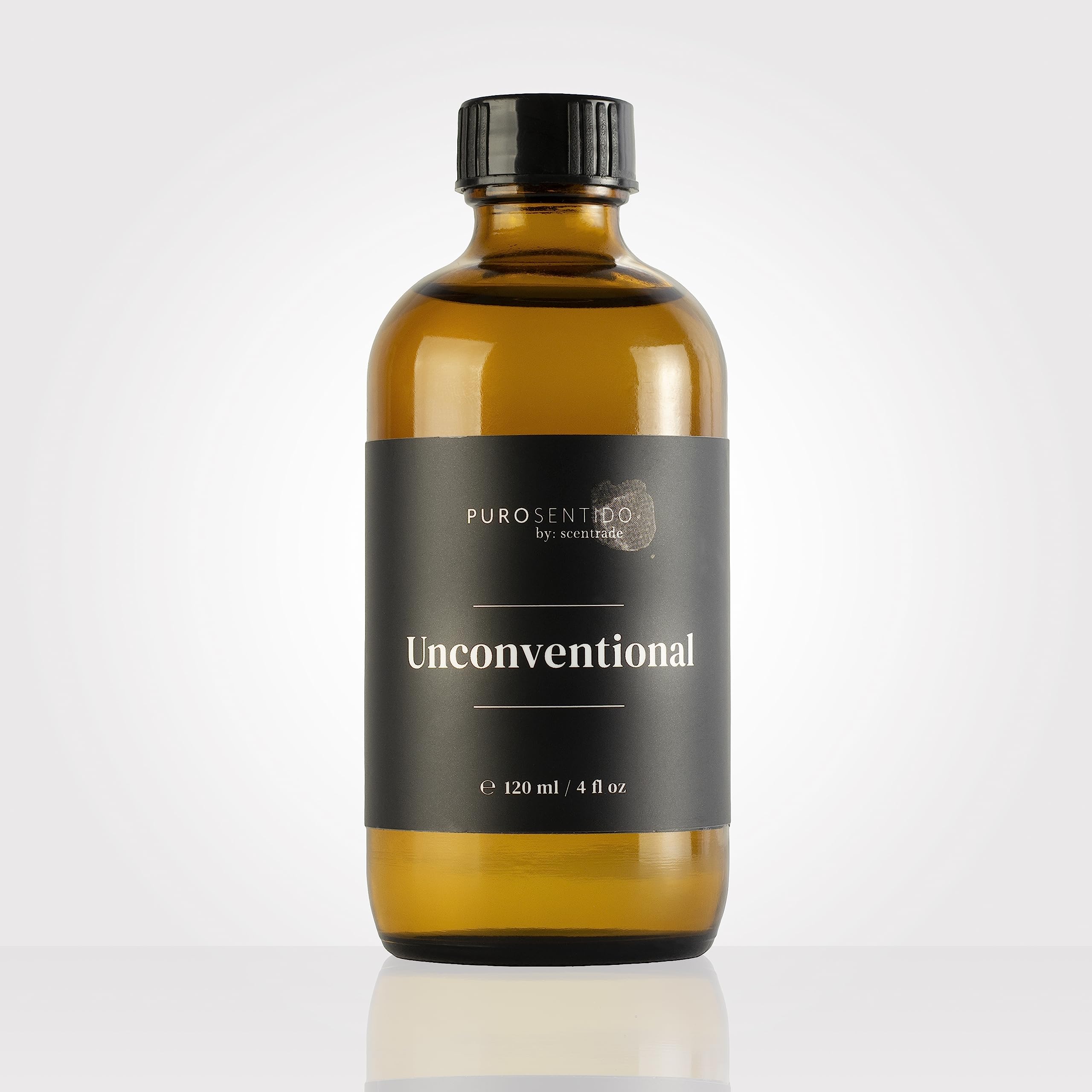 PuroSentido Unconventional Aroma Oil bottle beside a diffuser for inviting ambience