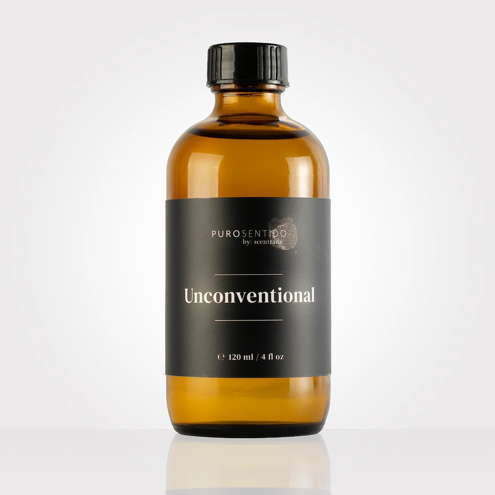 PuroSentido Unconventional Aroma Oil bottle beside a diffuser for inviting ambience