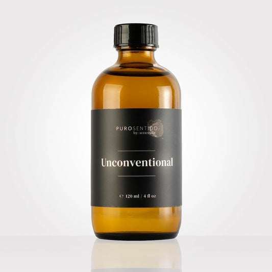 PuroSentido Unconventional Aroma Oil bottle beside a diffuser for inviting ambience