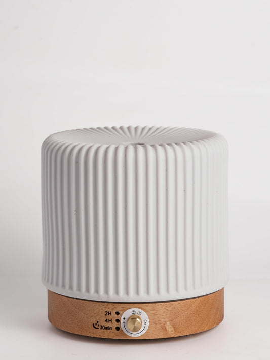 QCYBDGLOV ceramic diffuser in a small office setup with gentle aroma diffusion