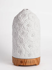 QCYBDGLOV Sunflower ceramic diffuser top view releasing soft ambient fragrance.