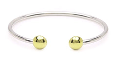 QRAY bracelet close-up shows oval terminals for ergonomic comfort.