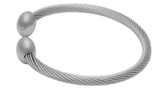 QRAY Silver Deluxe on wrist during golf swing suggests calm focus and steady posture.