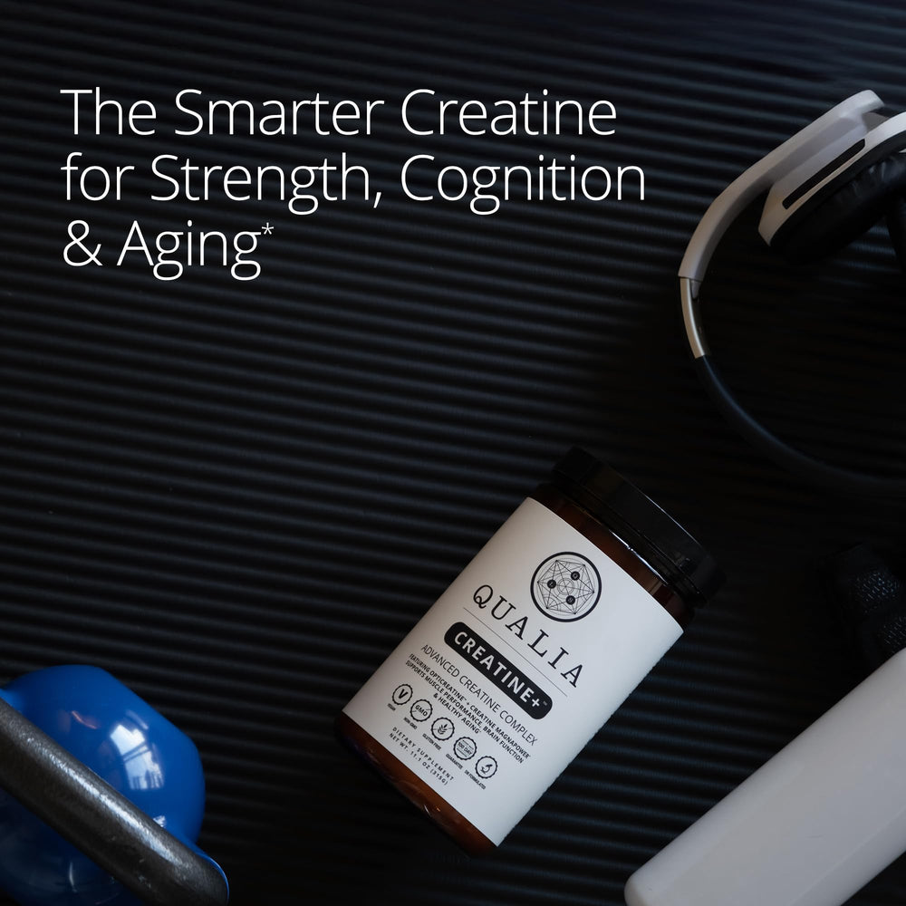 Qualia Creatine scoop pictured beside bottle for serving clarity.