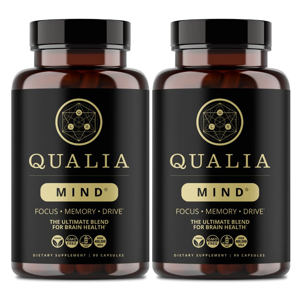 Qualia Mind bottle closeup shows premium nootropic blend for focused energy.