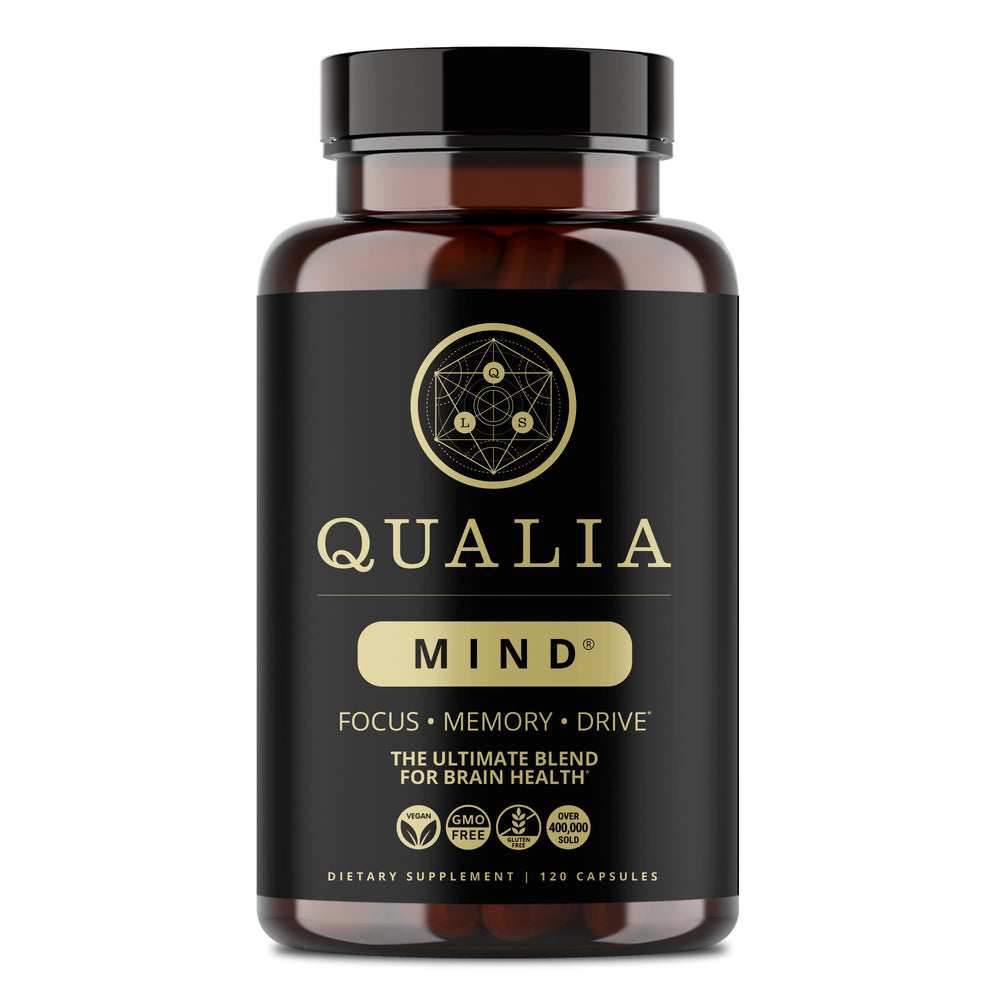 Qualia Mind bottle on desk signaling focus and productivity benefits.