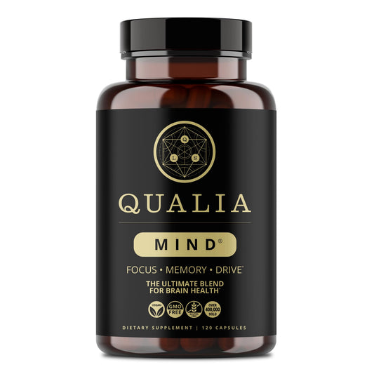 Qualia Mind bottle on desk signaling focus and productivity benefits.