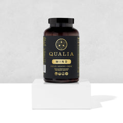 Qualia Mind capsules arranged neatly for daily routines.
