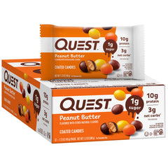 Quest coated candies shell closeup shows crunchy texture and peanut butter center.