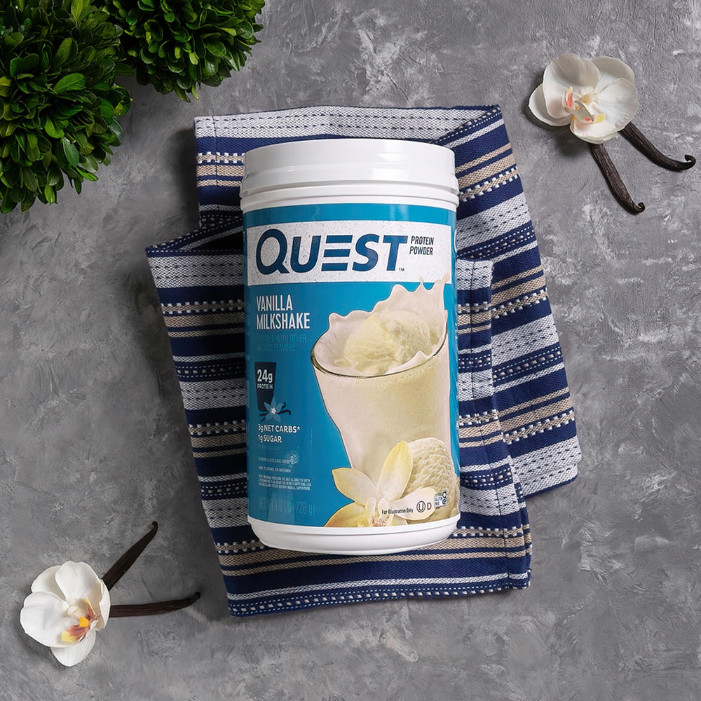 Quest Vanilla Milkshake powder shown being mixed for a smooth shake.