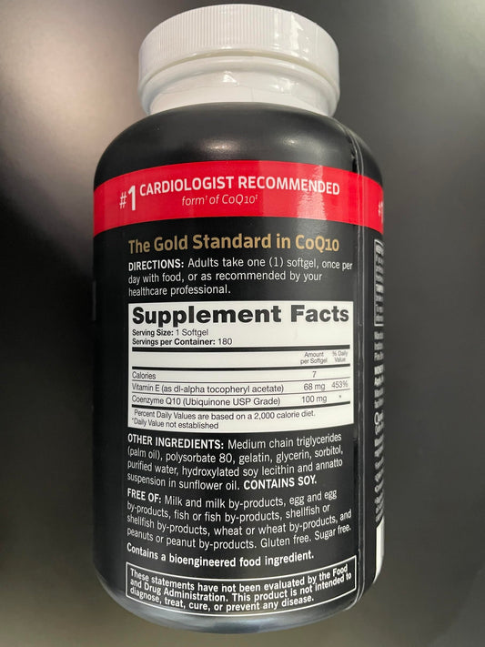 Qunol Ultra CoQ10 softgels being poured from the bottle.