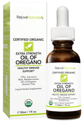 Close-up of the dropper releasing oregano oil for precise dosing.