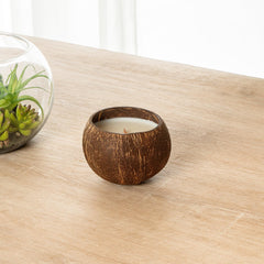 Restaurantware Coco Casa eco-friendly candle made from reclaimed materials.