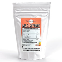 Revitalize Wellness Mag Defense powder with a teaspoon scoop for easy daily magnesium support