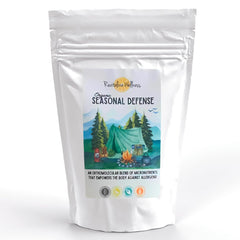 Revitalize Wellness Seasonal Defense Powder bottle for daily immune support.
