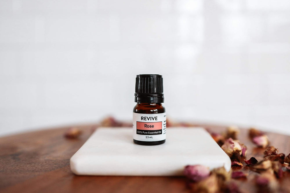 REVIVEEO Rose Essential Oil used in diffuser for calming fragrance.