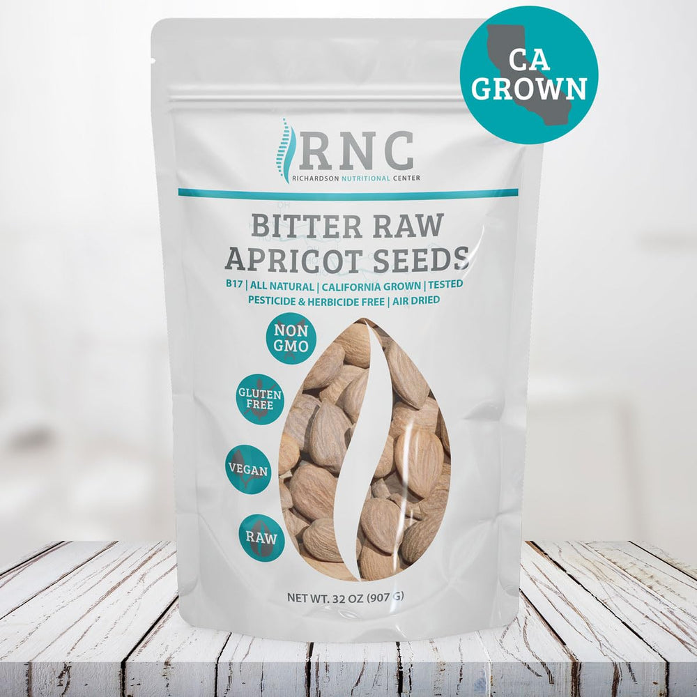 Richardson Nutritional Center fresh raw apricot seeds near bowl, ideal for smoothie boosts.
