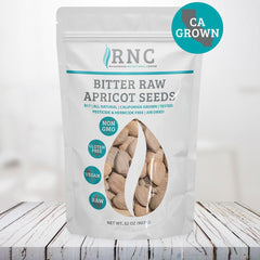 Richardson Nutritional Center fresh raw apricot seeds near bowl, ideal for smoothie boosts.