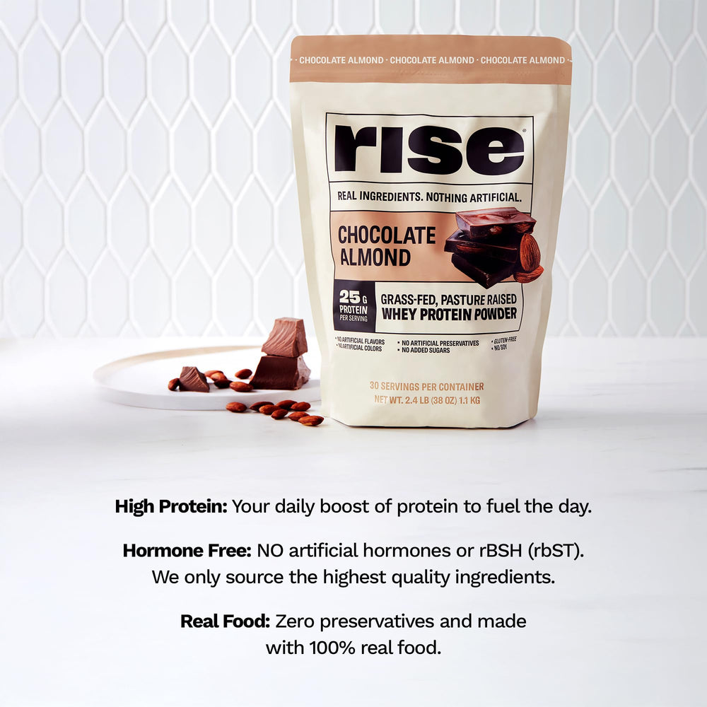 Rise New Zealand grass-fed whey shown with pasture origin in focus.