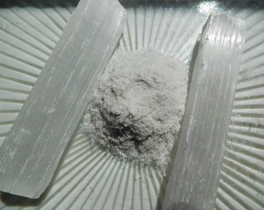 Close-up of fine selenite powder highlighting its texture for art and crafts.